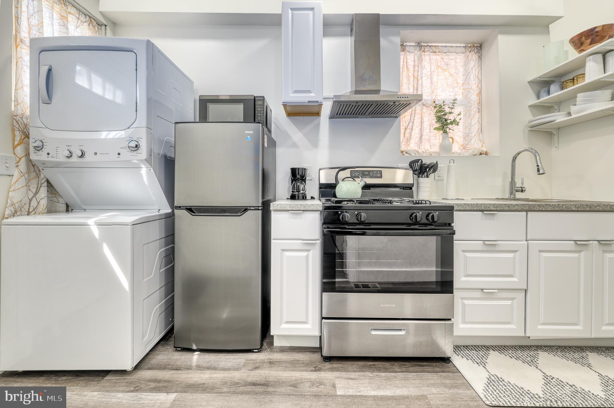 7104 Harford Road Baltimore, MD 21234 - Photo 27 of 37 a kitchen with a refrigerator and a stove