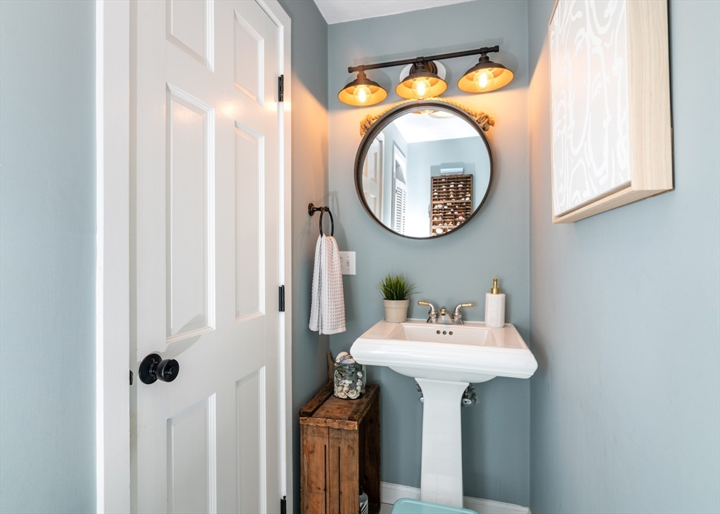 255 Elm Street Marshfield, MA 02050 - Photo 16 of 42 a bathroom with a sink and a mirror