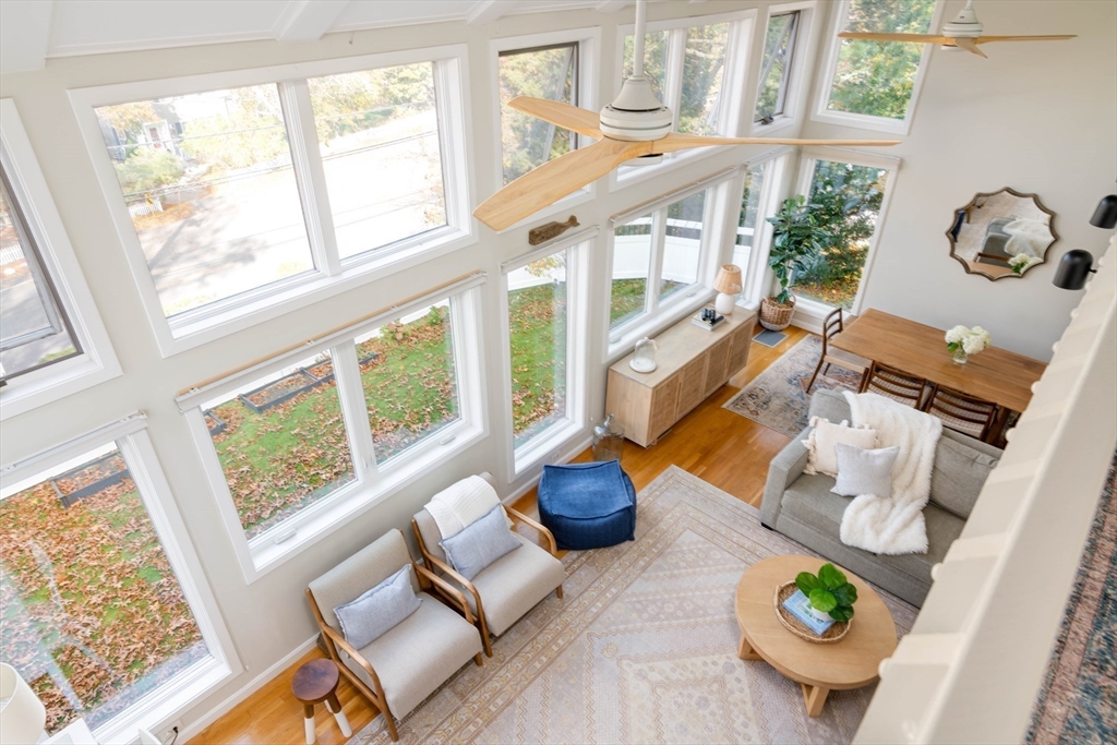 255 Elm Street Marshfield, MA 02050 - Photo 18 of 42 a living room with furniture and a floor to ceiling window