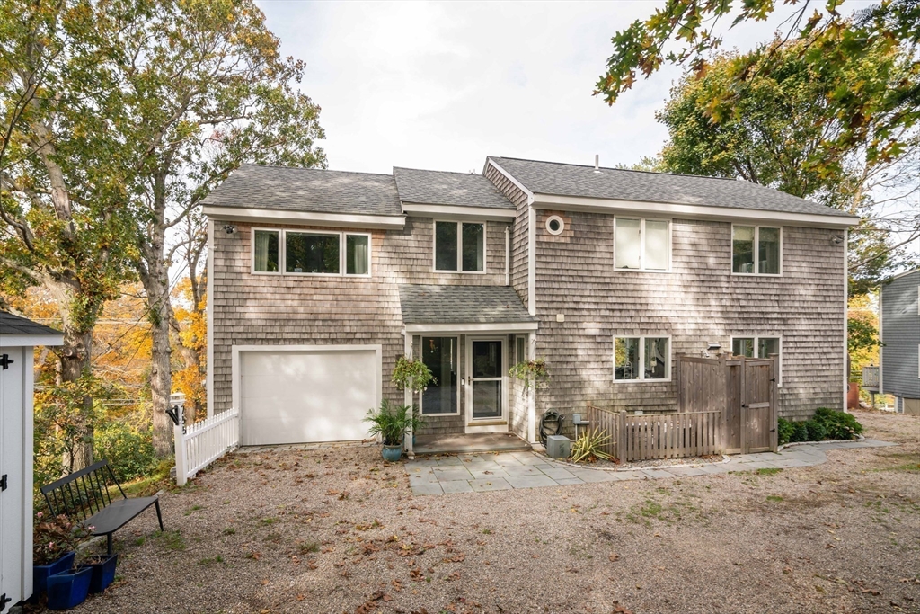 255 Elm Street Marshfield, MA 02050 - Photo 2 of 42 a front view of a house with a yard and garage