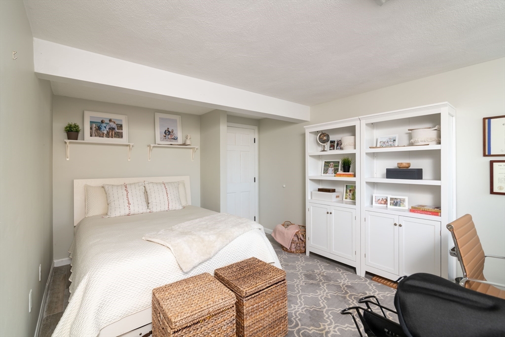 255 Elm Street Marshfield, MA 02050 - Photo 26 of 42 a bedroom with a bed and furniture