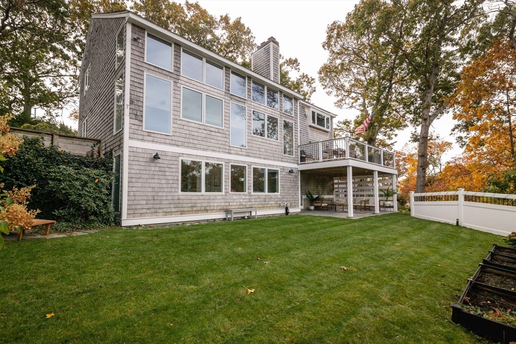 255 Elm Street Marshfield, MA 02050 - Photo 36 of 42 a view of a house with a yard and sitting area