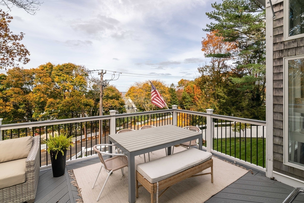 255 Elm Street Marshfield, MA 02050 - Photo 37 of 42 a view of a roof deck with couches and wooden floor