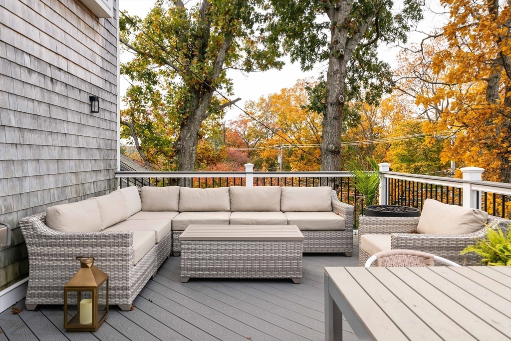 255 Elm Street Marshfield, MA 02050 - Photo 38 of 42 a roof deck with couches and wooden floor