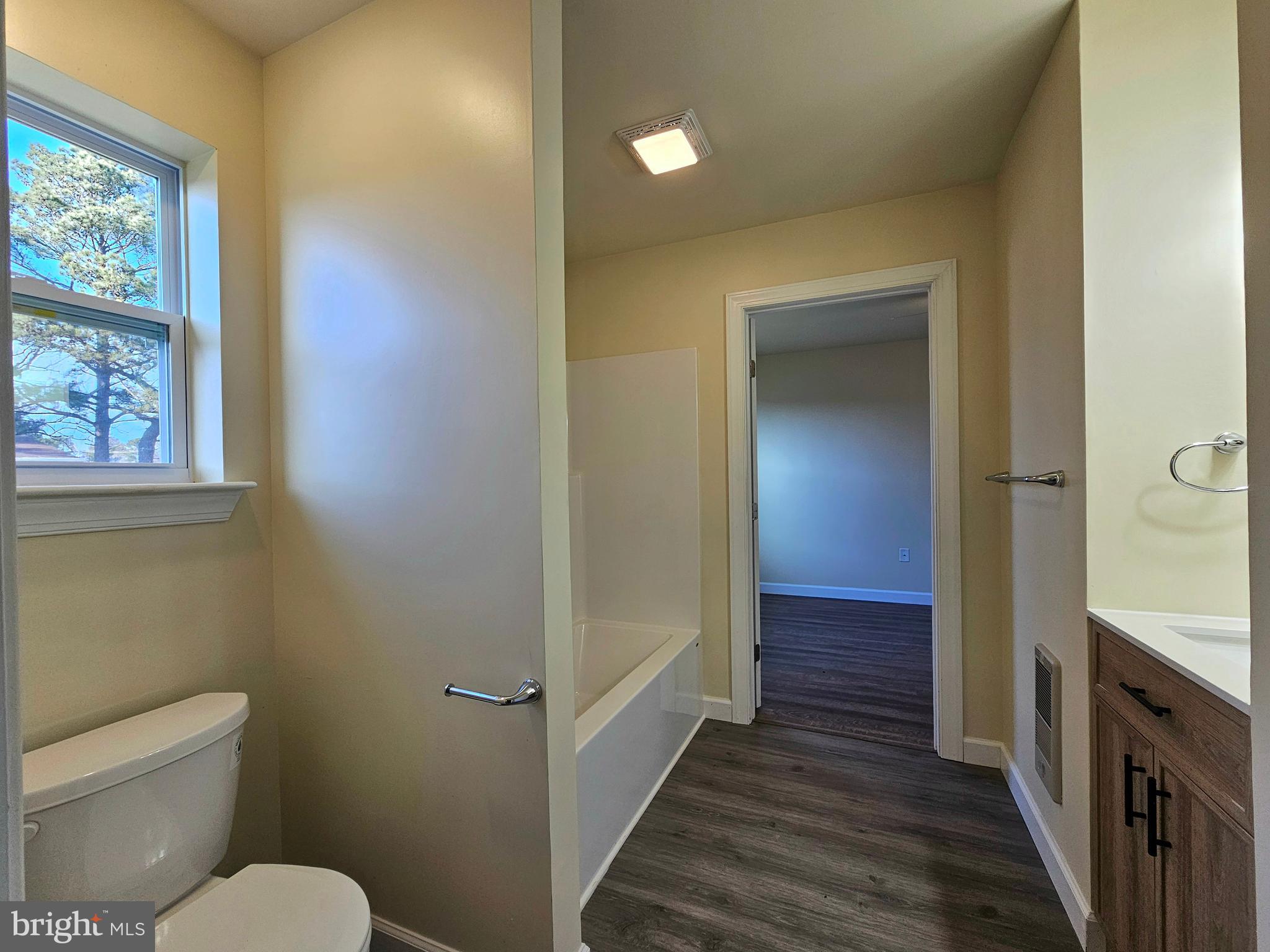 26404 Franklin Road Crisfield, MD 21817 - Photo 21 of 31 a bathroom with a toilet sink and vanity