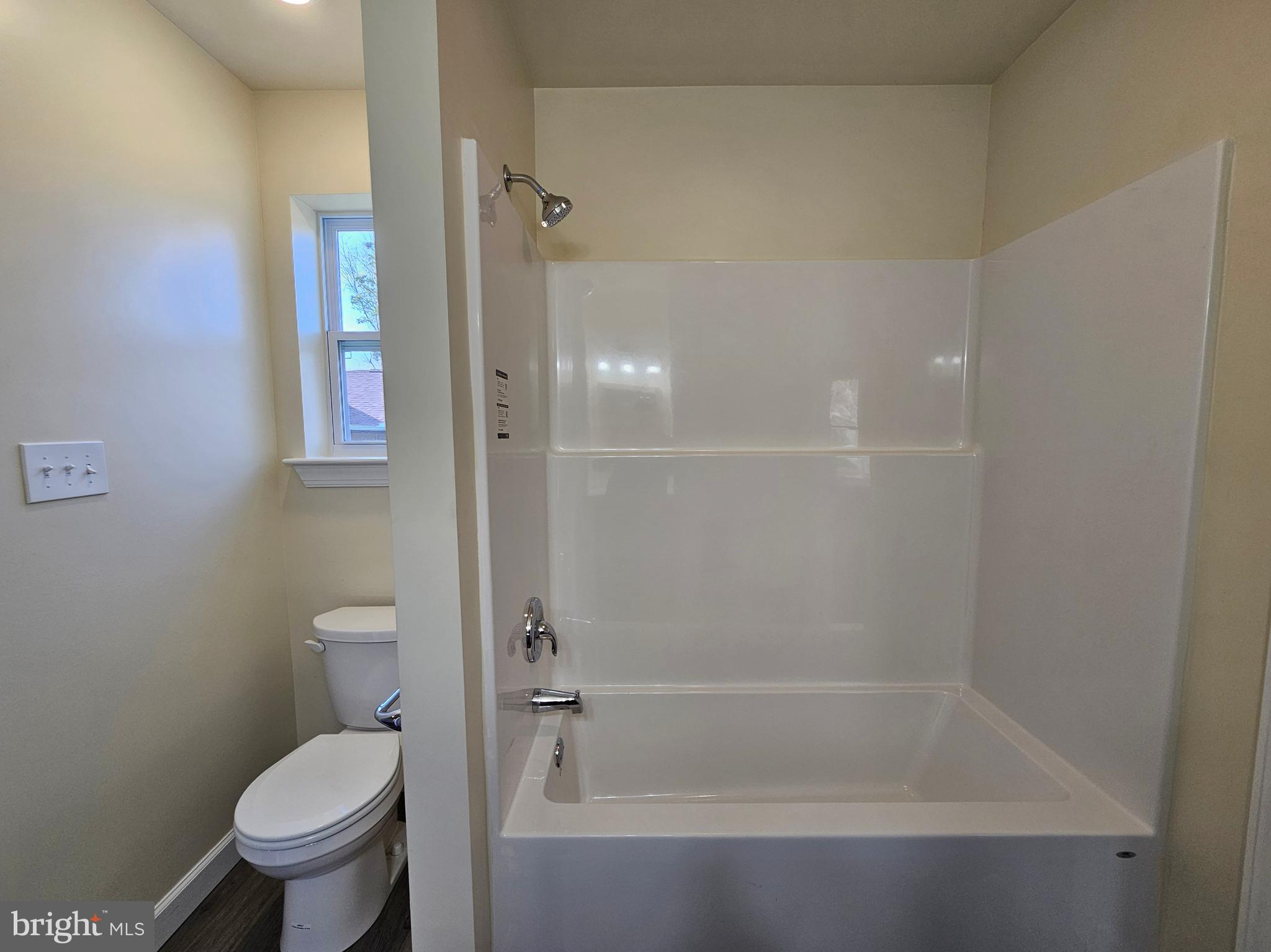 26404 Franklin Road Crisfield, MD 21817 - Photo 23 of 31 a bathroom with a bathtub and a toilet