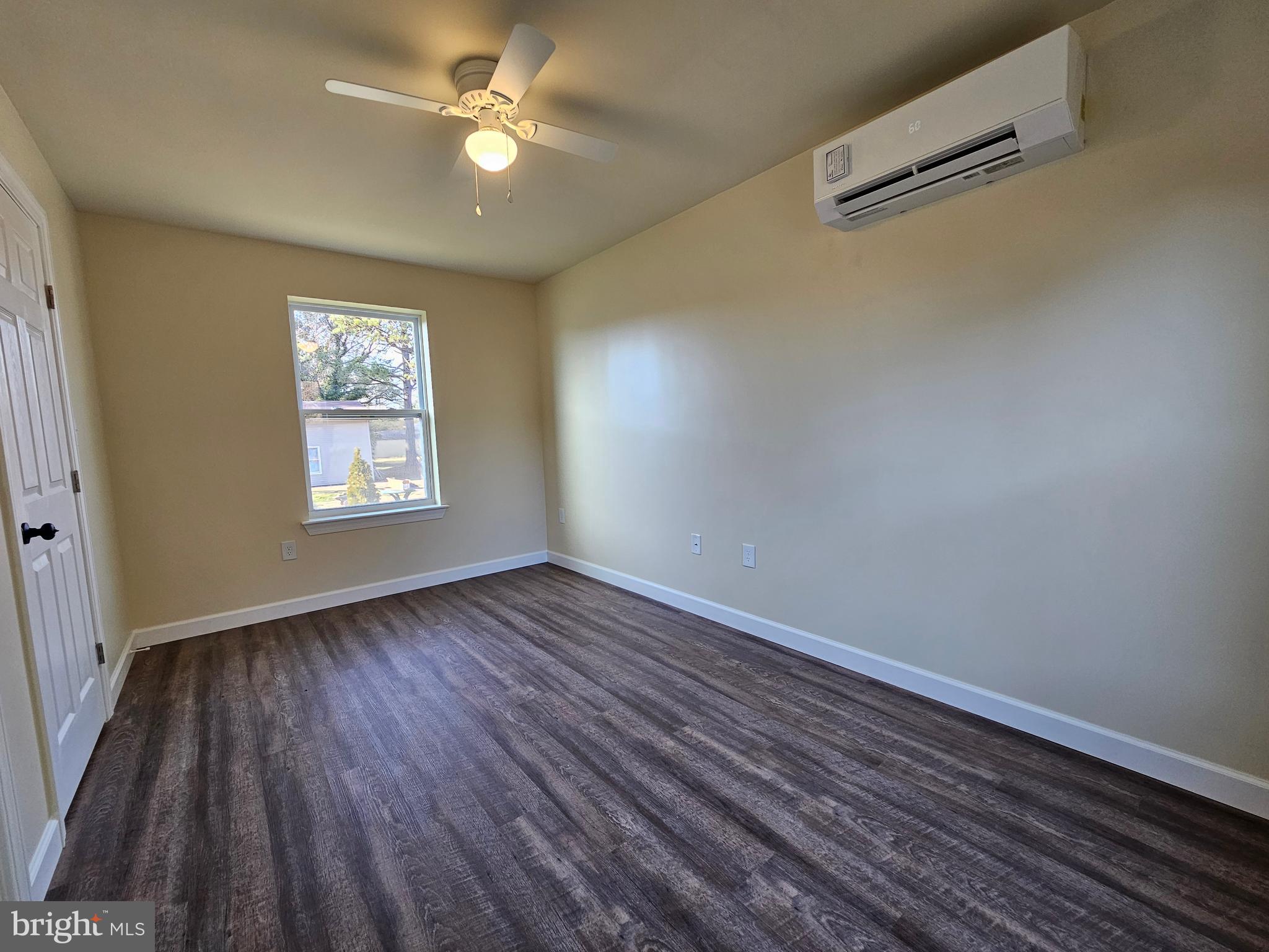 26404 Franklin Road Crisfield, MD 21817 - Photo 25 of 31 wooden floor in an empty room with a window