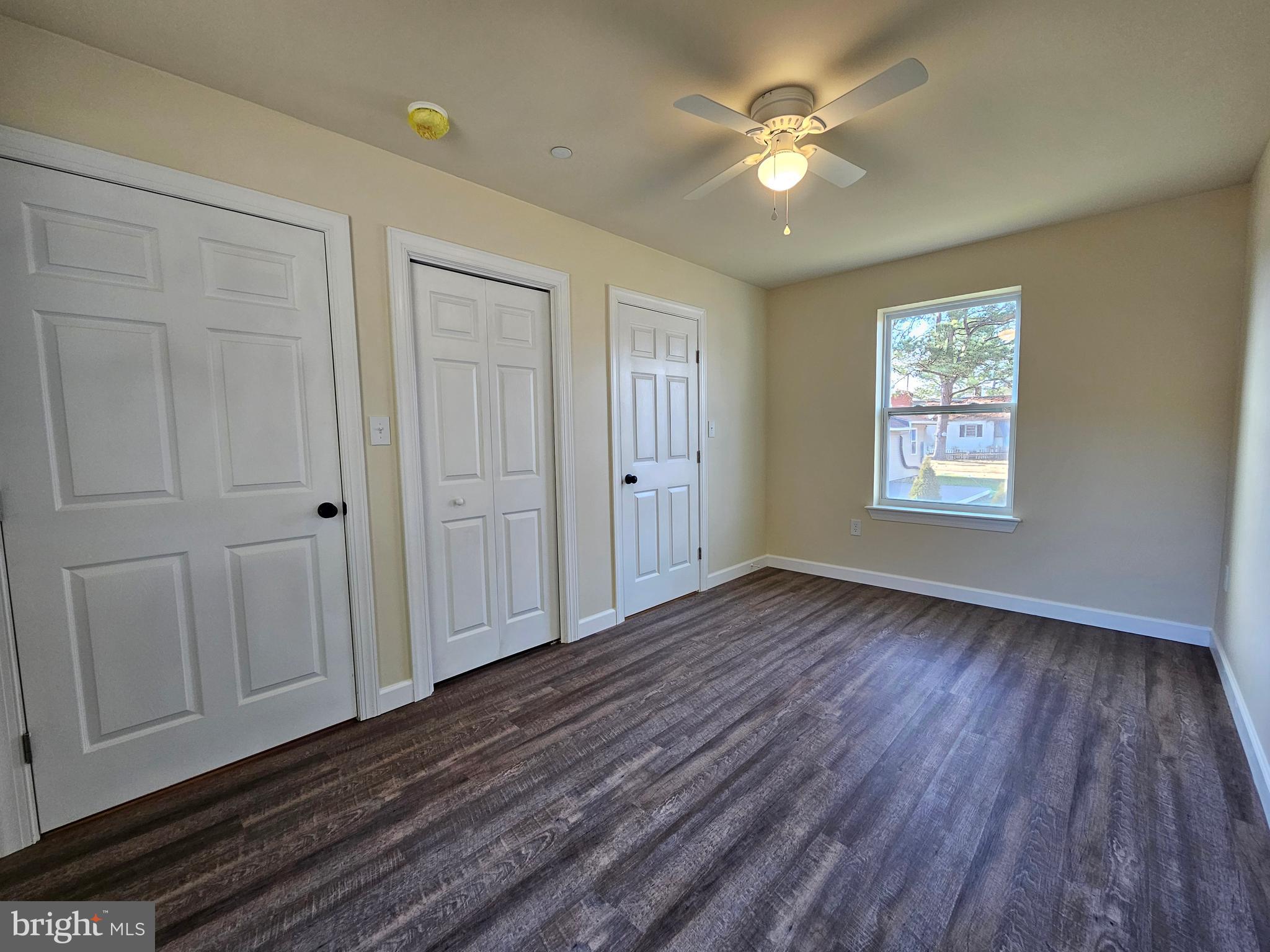 26404 Franklin Road Crisfield, MD 21817 - Photo 26 of 31 a view of an empty room with a window and wooden floor