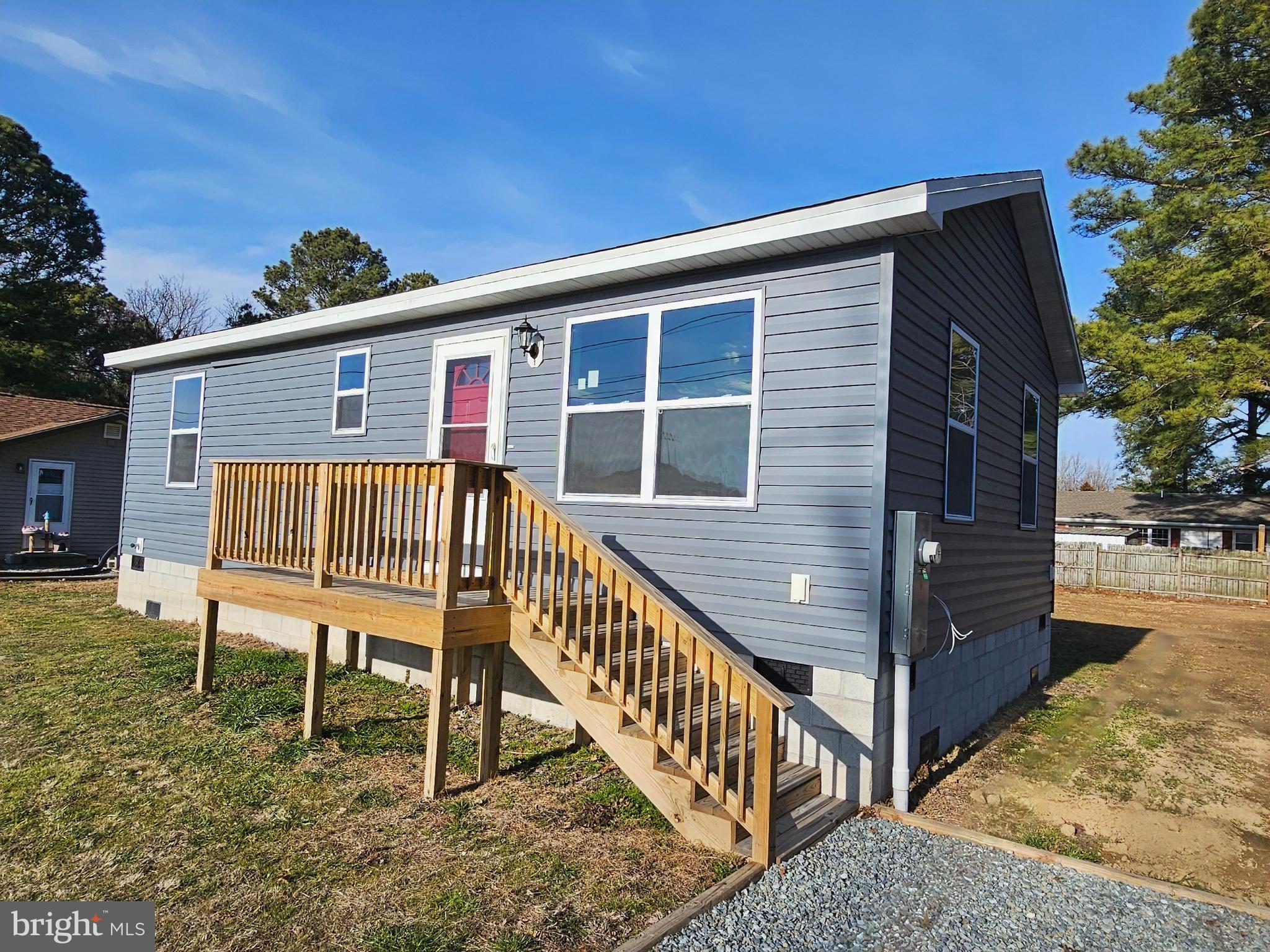 26404 Franklin Road Crisfield, MD 21817 - Photo 27 of 31 a view of a house with backyard and a chair