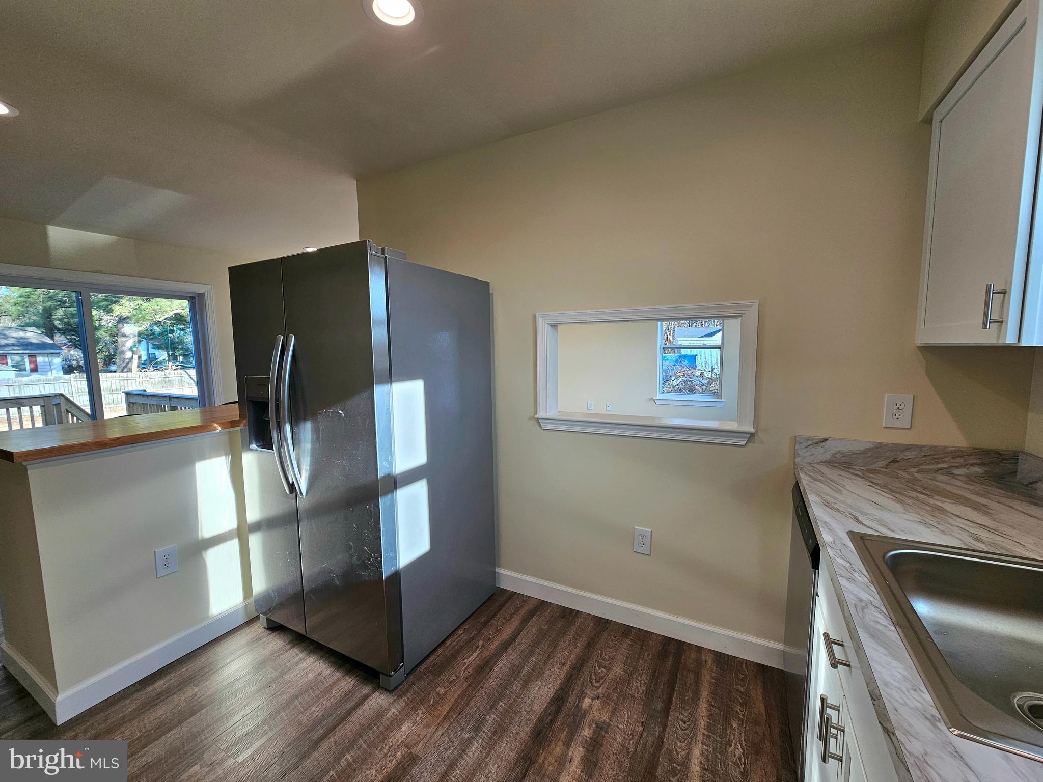 26404 Franklin Road Crisfield, MD 21817 - Photo 7 of 31 a kitchen with a refrigerator and window