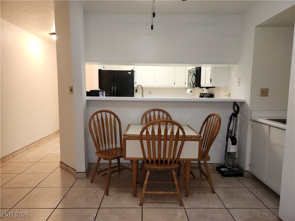 2016 Mesquite Lane, Unit 104 Laughlin, NV 89029 - Photo 7 of 24 Dining area with convenient breakfast bar and wet bar.