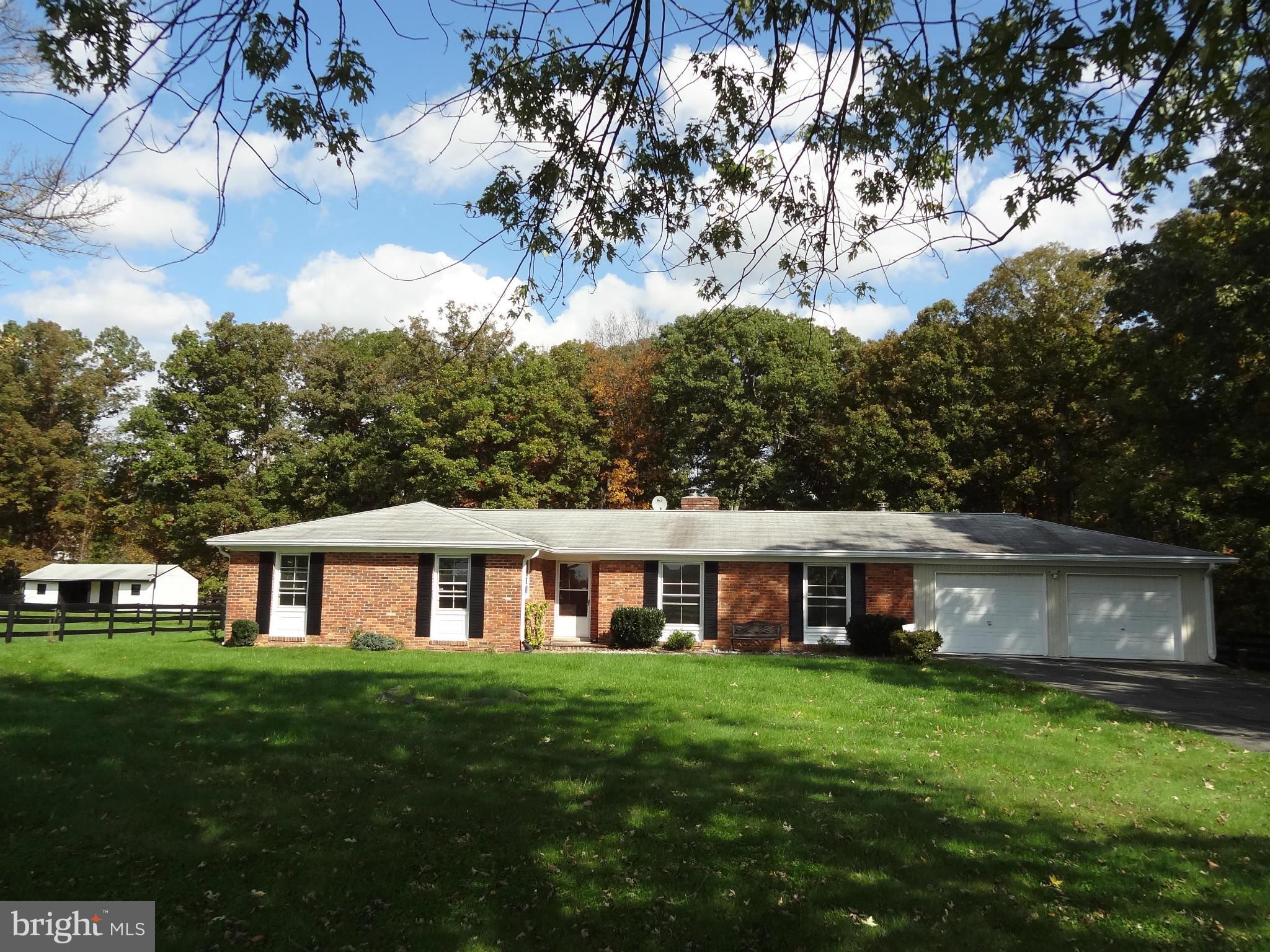 4878 Dumfries Road Catlett, VA 20119 - Photo 2 of 30 a front view of a house with a yard