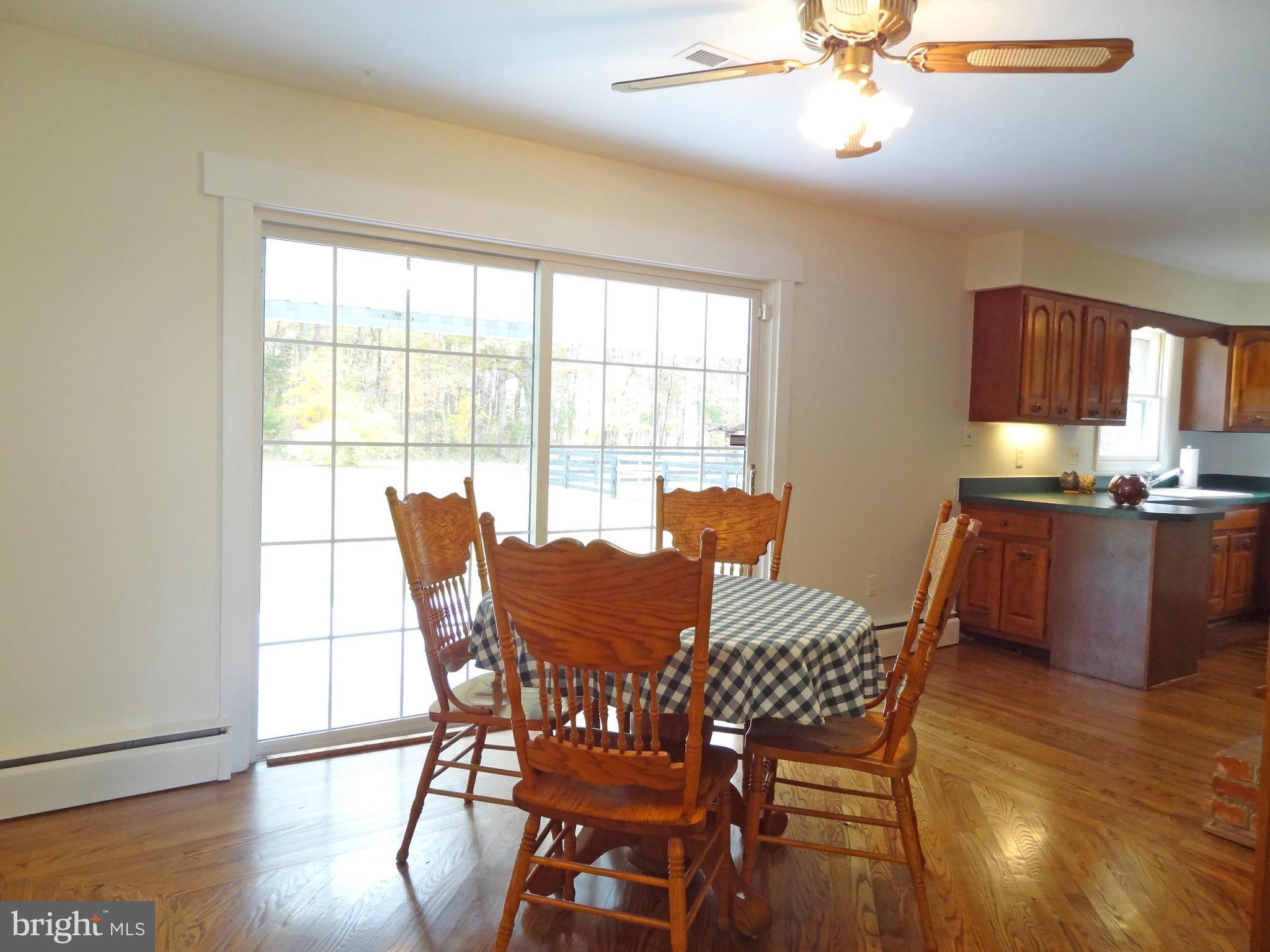 4878 Dumfries Road Catlett, VA 20119 - Photo 11 of 30 a view of a dining room with furniture window and wooden floor