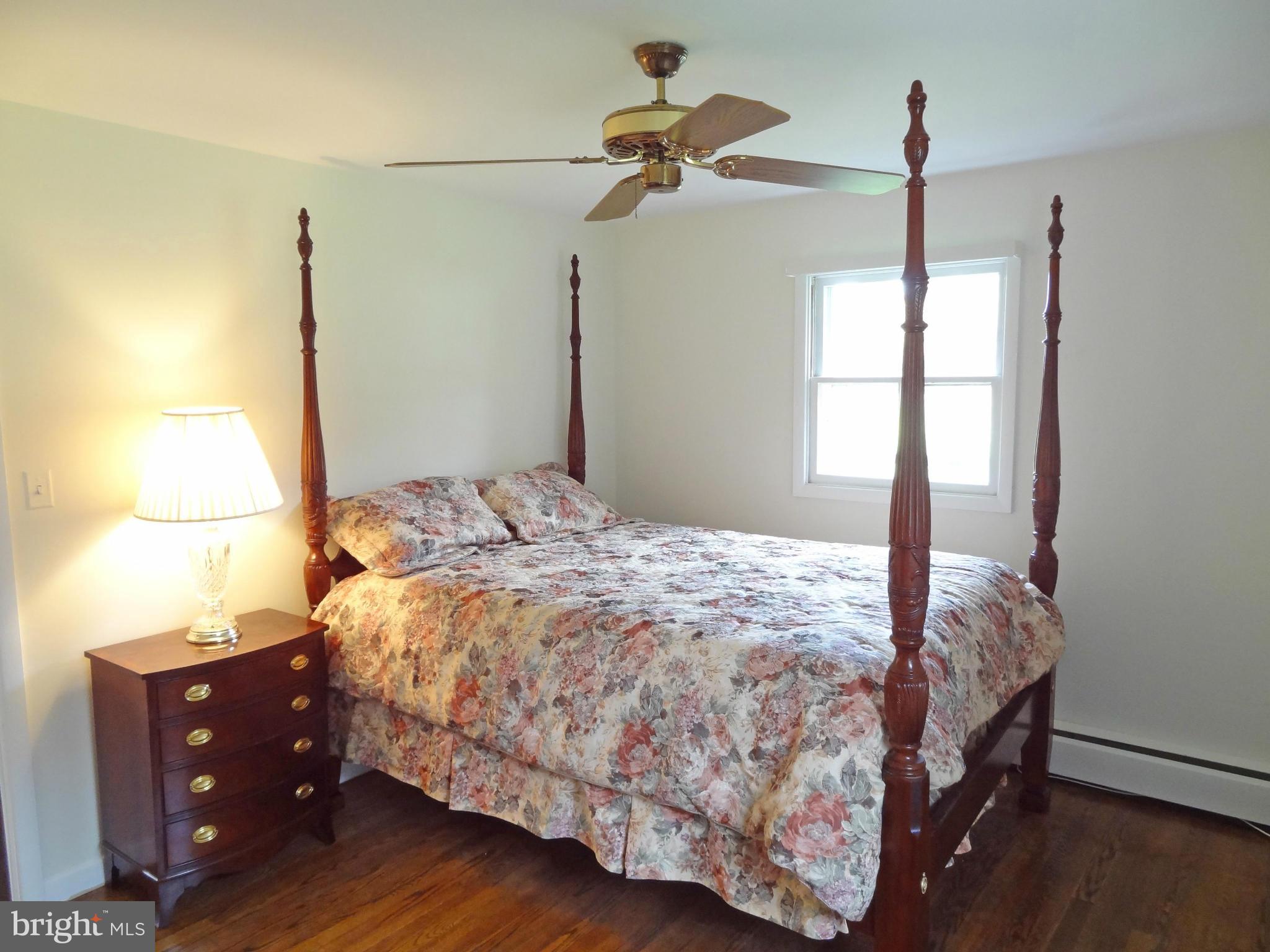 4878 Dumfries Road Catlett, VA 20119 - Photo 17 of 30 a bedroom with a bed and a window