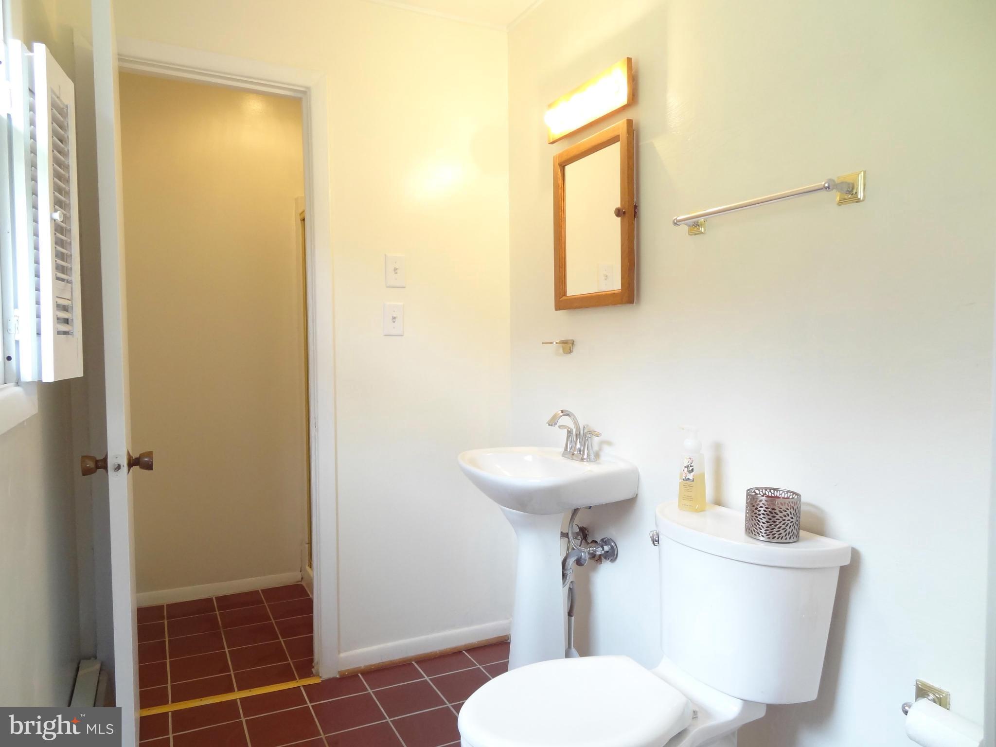 4878 Dumfries Road Catlett, VA 20119 - Photo 18 of 30 a bathroom with a sink mirror toilet and shower