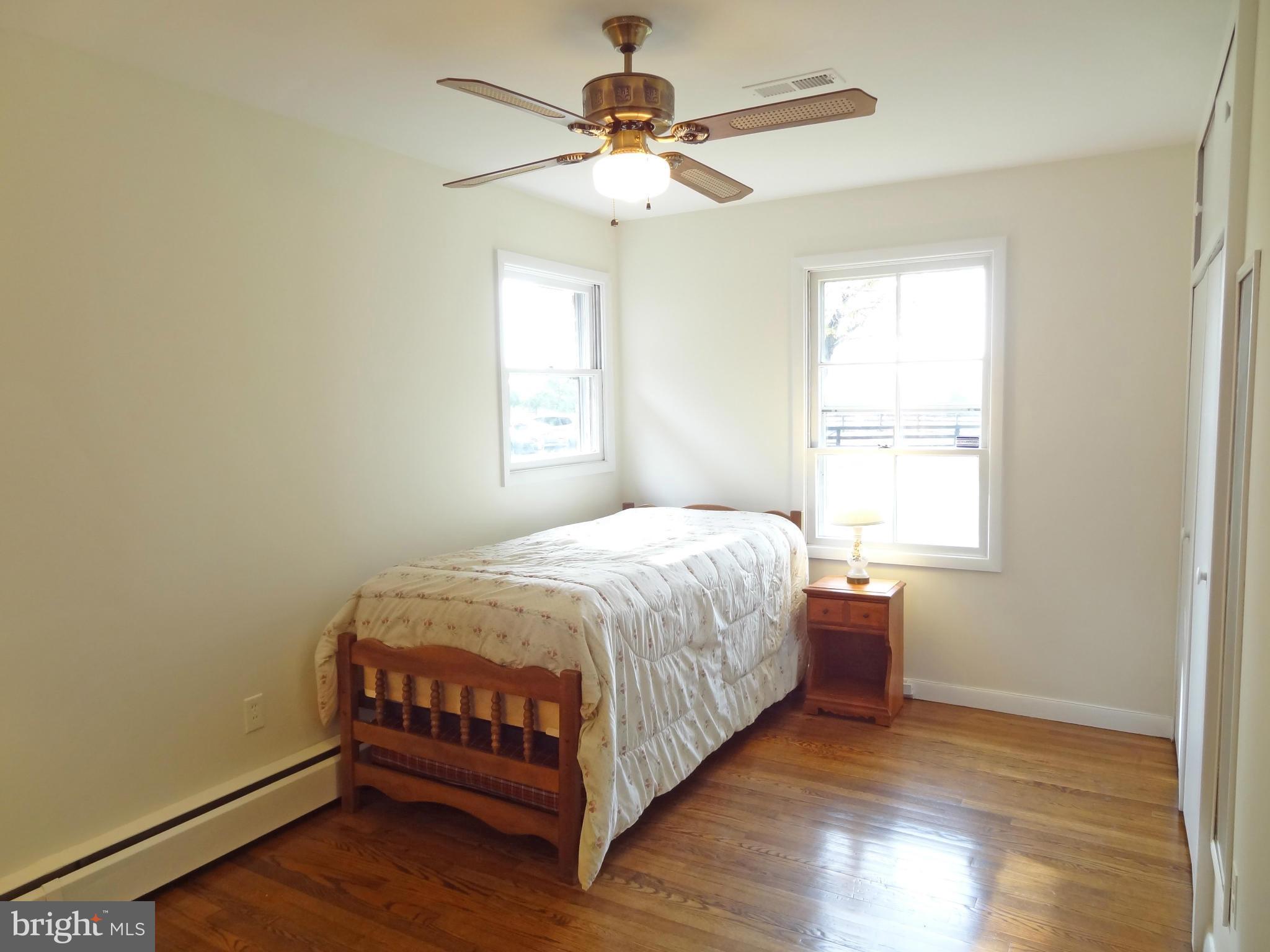 4878 Dumfries Road Catlett, VA 20119 - Photo 21 of 30 a bedroom with a bed and a chandelier
