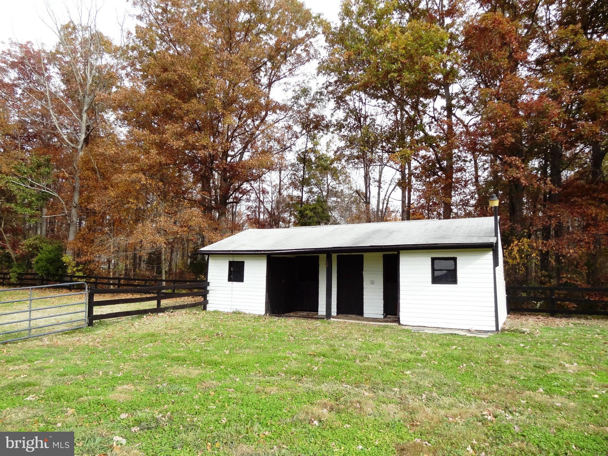 4878 Dumfries Road Catlett, VA 20119 - Photo 24 of 30 a view of a house with backyard and tree