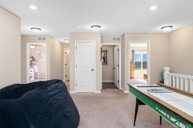 a living room with a bed and a table