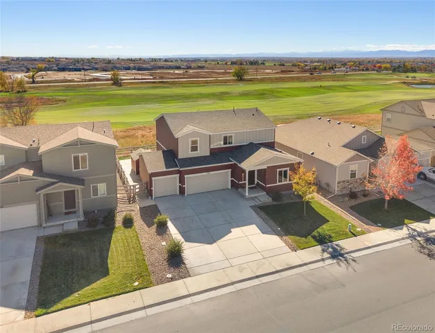 an aerial view of a house with a ocean view