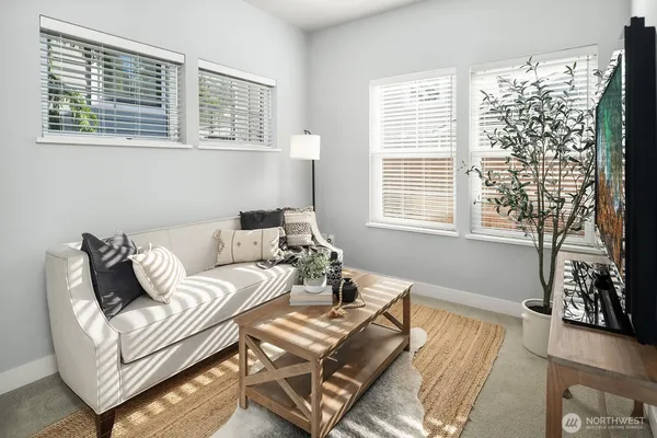 a living room with furniture and a window