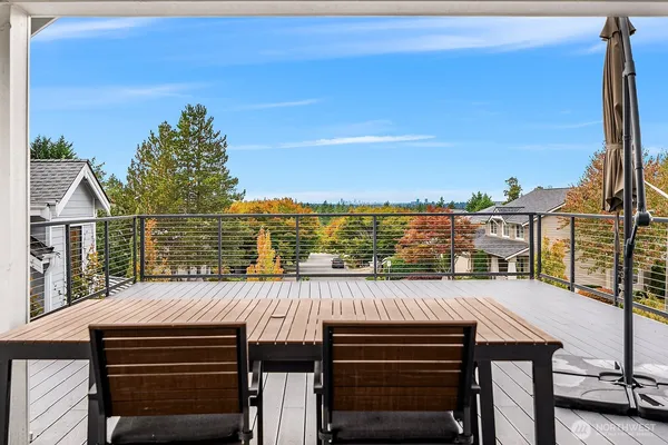 a view of a balcony with furniture