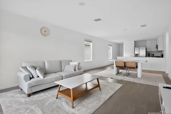 a living room with furniture and a table