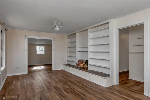 a view of a livingroom with wooden floor and closet