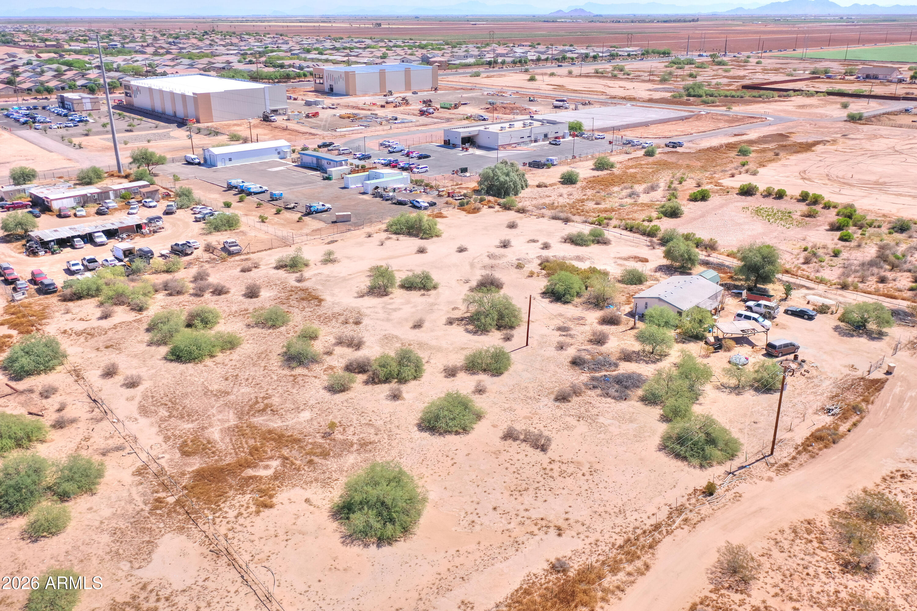 40526 West 7 Ranch Road Maricopa, AZ 85138 - Photo 5 of 14 an aerial view of residential houses with wooden space