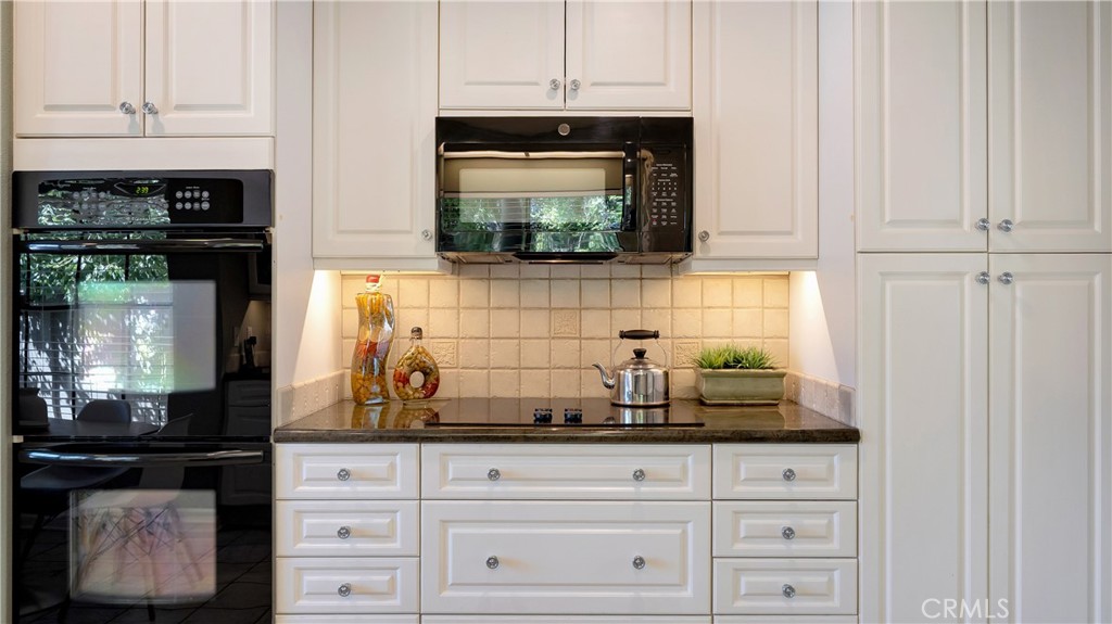 65 Pinewood, Unit 33 Irvine, CA 92604 - Photo 12 of 41 Jennair ceramic cooktop and GE space saver microwave