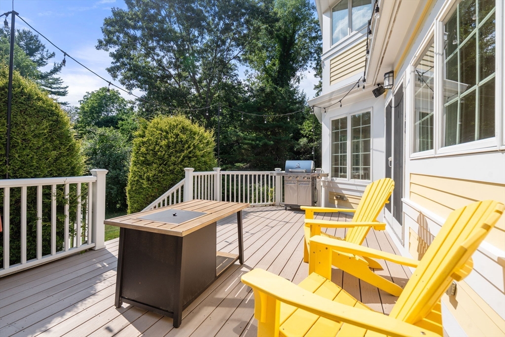 24 Russett Hill Road Sherborn, MA 01770 - Photo 12 of 39 a view of a patio with couches chairs and wooden floor