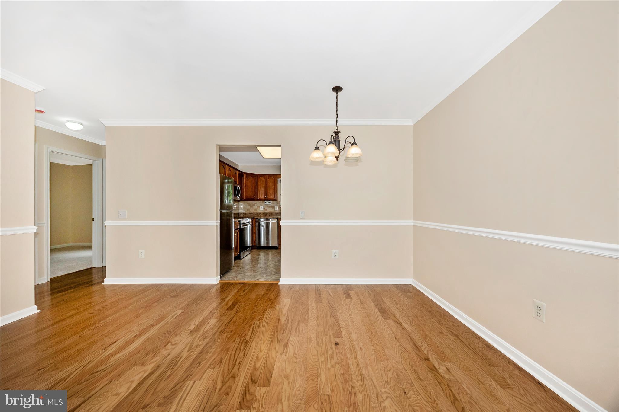 1007 Parade Lane Mount Airy, MD 21771 - Photo 12 of 55 wooden floor in an empty room with a window