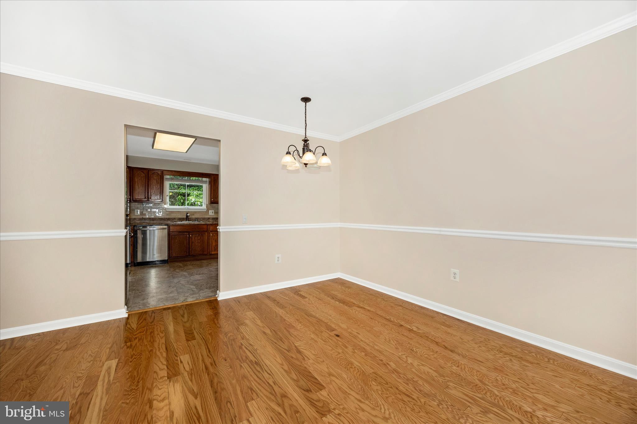 1007 Parade Lane Mount Airy, MD 21771 - Photo 14 of 55 wooden floor in an empty room with a window