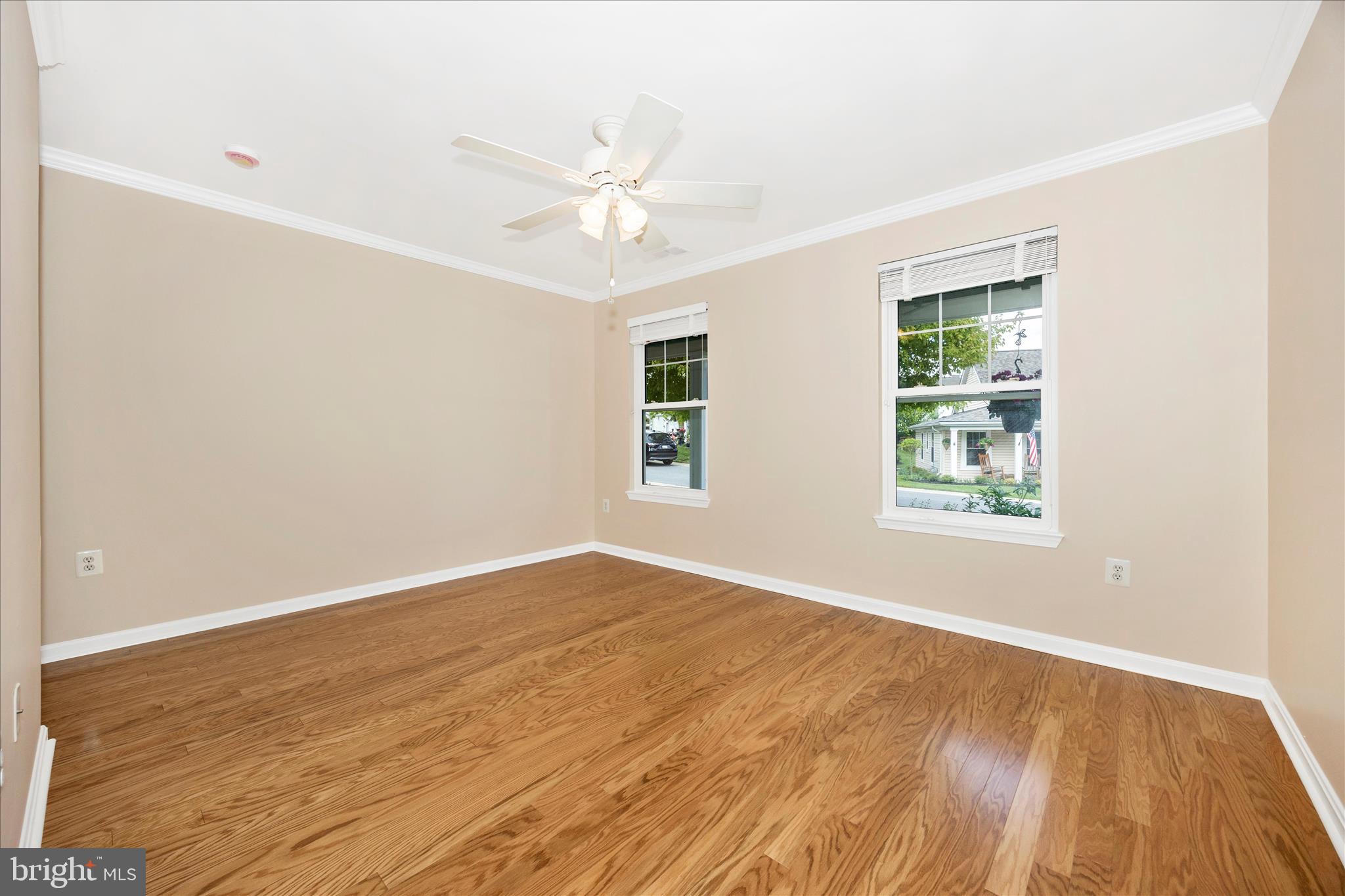 1007 Parade Lane Mount Airy, MD 21771 - Photo 29 of 55 a view of an empty room with wooden floor and a window