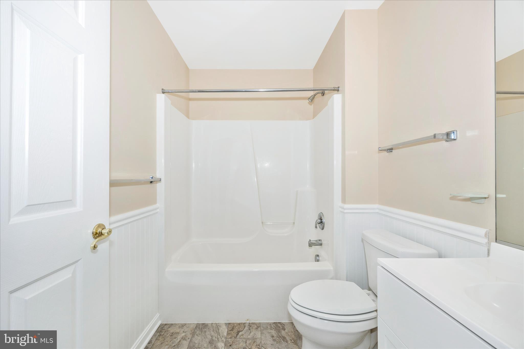 1007 Parade Lane Mount Airy, MD 21771 - Photo 37 of 55 a bathroom with a granite countertop bathtub shower sink vanity and toilet