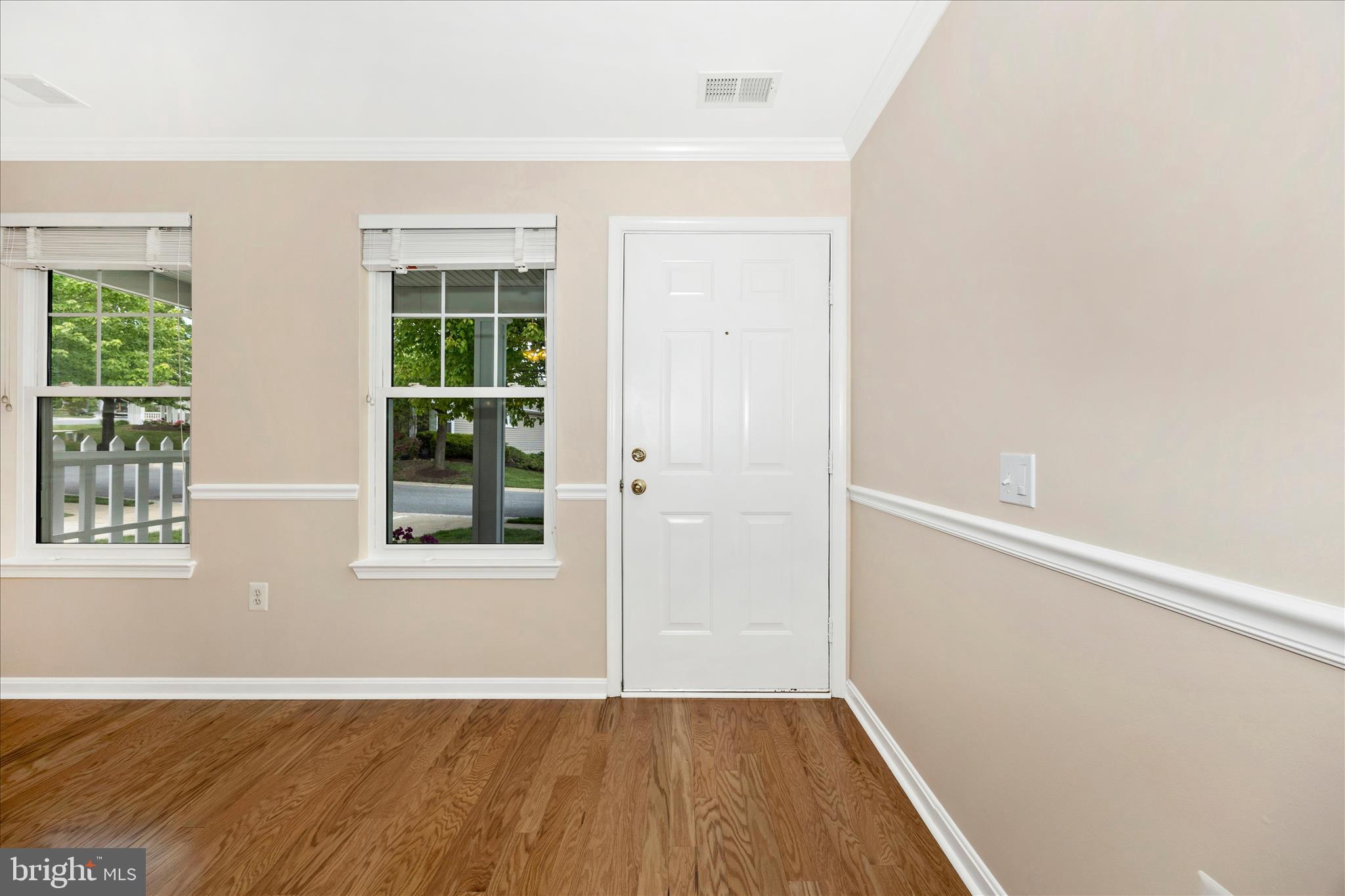 1007 Parade Lane Mount Airy, MD 21771 - Photo 5 of 55 an empty room with wooden floor and windows