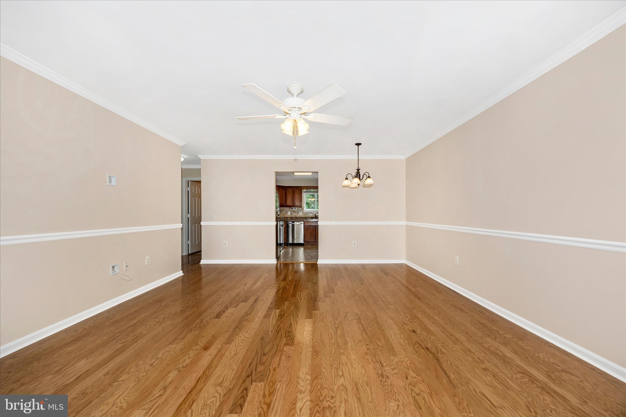 1007 Parade Lane Mount Airy, MD 21771 - Photo 8 of 55 wooden floor in an empty room with a window