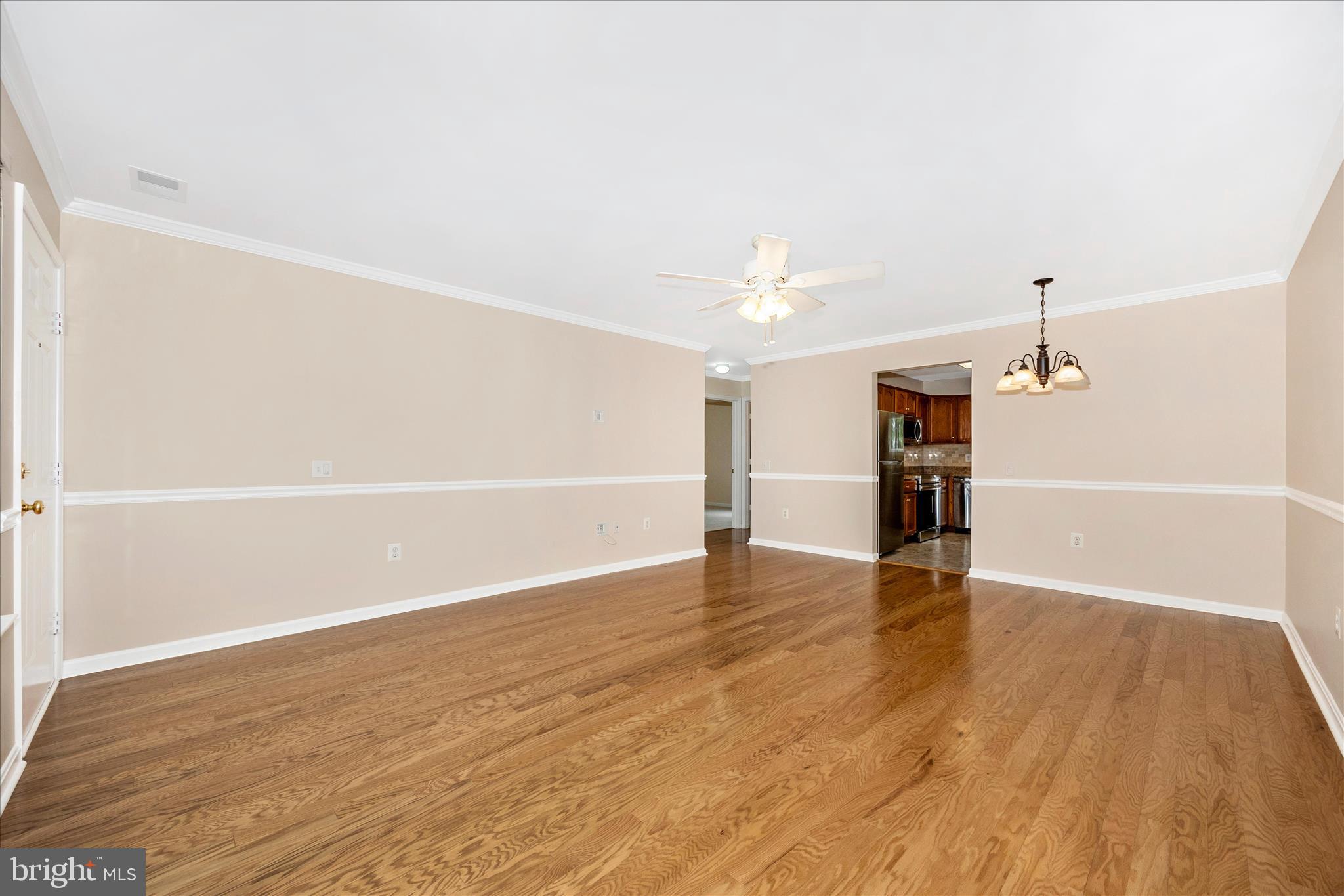 1007 Parade Lane Mount Airy, MD 21771 - Photo 9 of 55 wooden floor in an empty room with a window