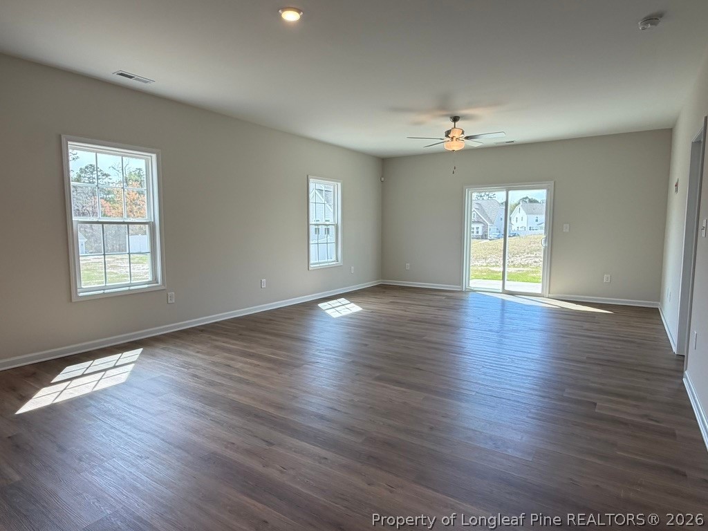 5409 Short Leaf Road Fayetteville, NC 28311 - Photo 14 of 40 an empty room with wooden floor and windows