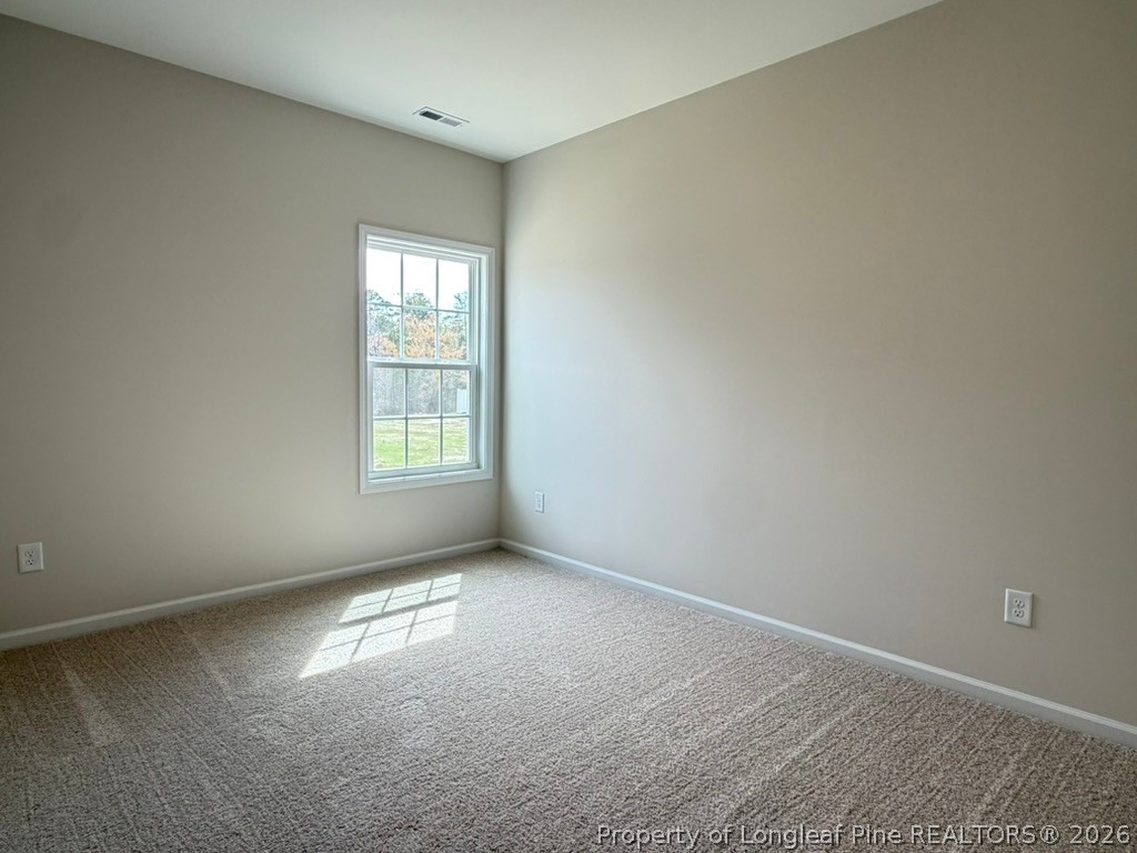 5409 Short Leaf Road Fayetteville, NC 28311 - Photo 7 of 40 an empty room with windows