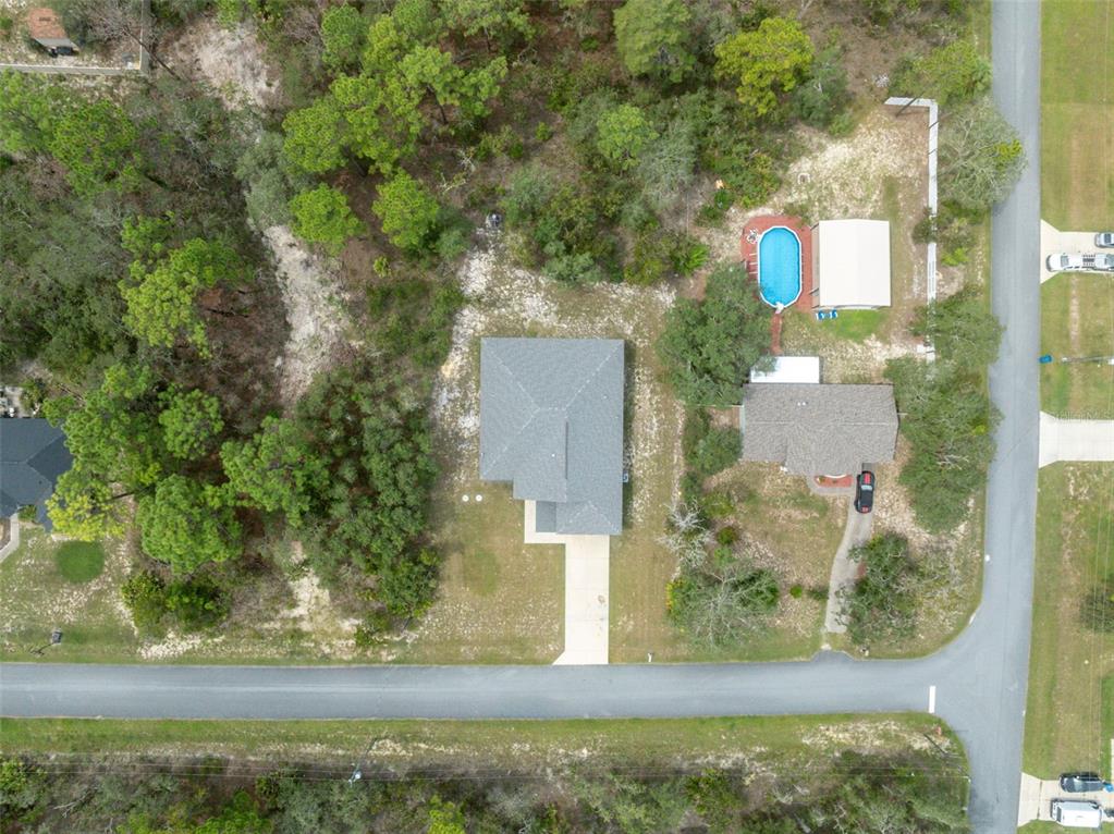 13073 Jaywalk Road Weeki Wachee, FL 34614 - Photo 24 of 44 an aerial view of residential houses with outdoor space