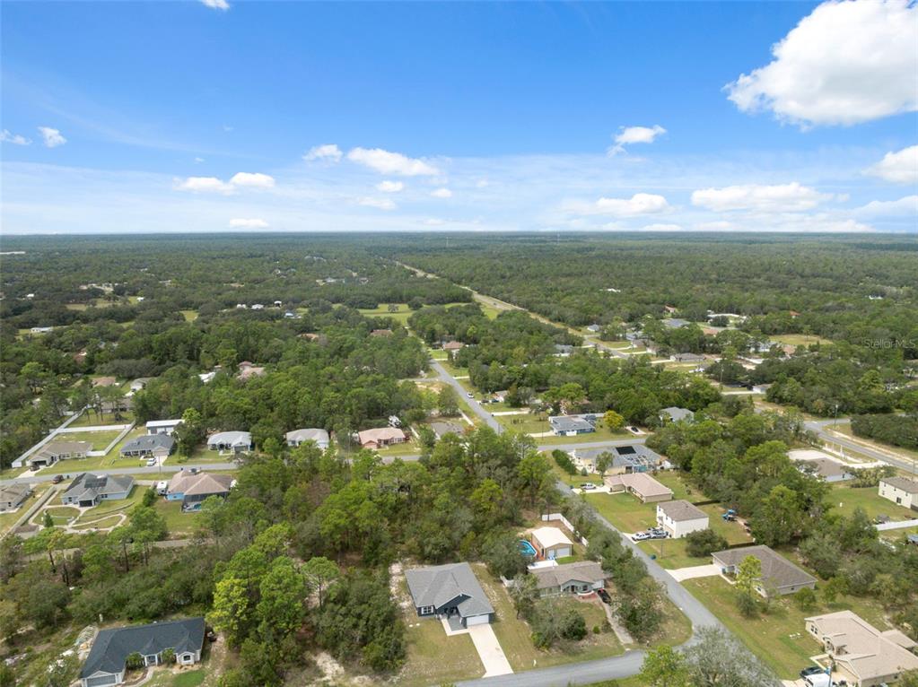 13073 Jaywalk Road Weeki Wachee, FL 34614 - Photo 25 of 44 an aerial view of residential houses with outdoor space
