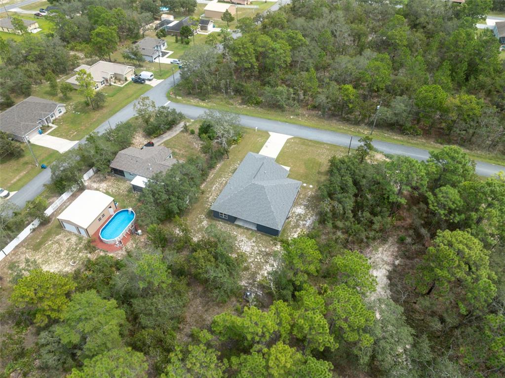 13073 Jaywalk Road Weeki Wachee, FL 34614 - Photo 29 of 44 an aerial view of a house with a yard
