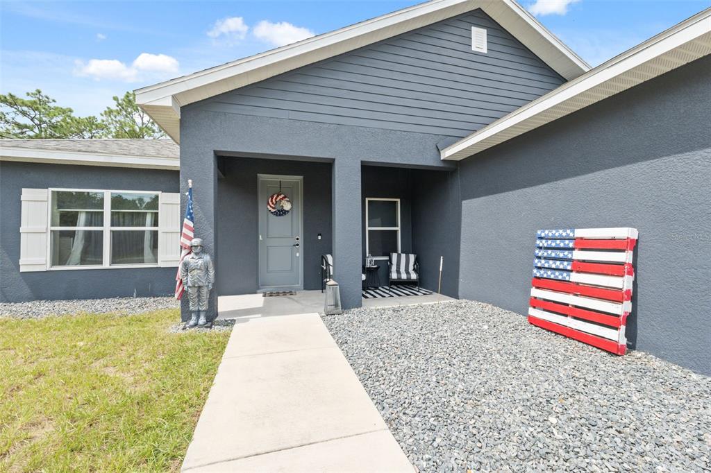 13073 Jaywalk Road Weeki Wachee, FL 34614 - Photo 3 of 44 a house view with a outdoor space