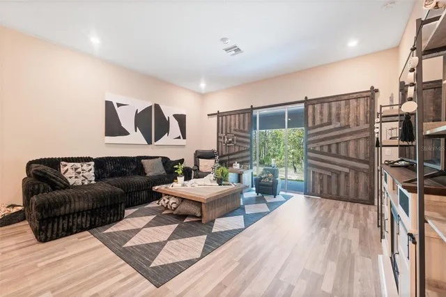 a bedroom with a bed and a television