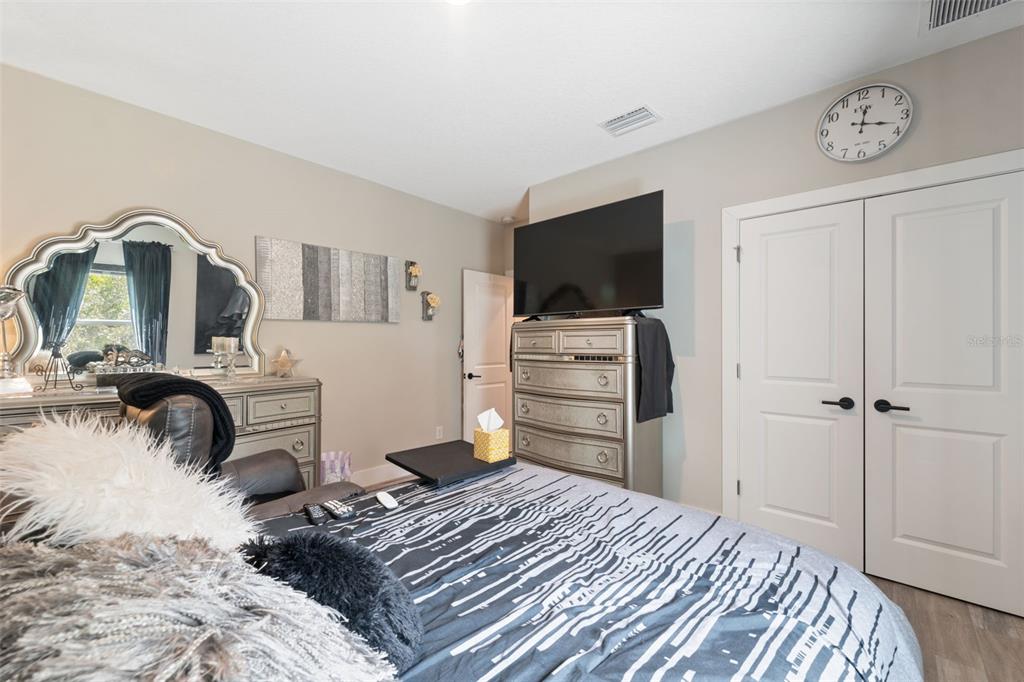 13073 Jaywalk Road Weeki Wachee, FL 34614 - Photo 42 of 44 a bedroom with a bed and a television