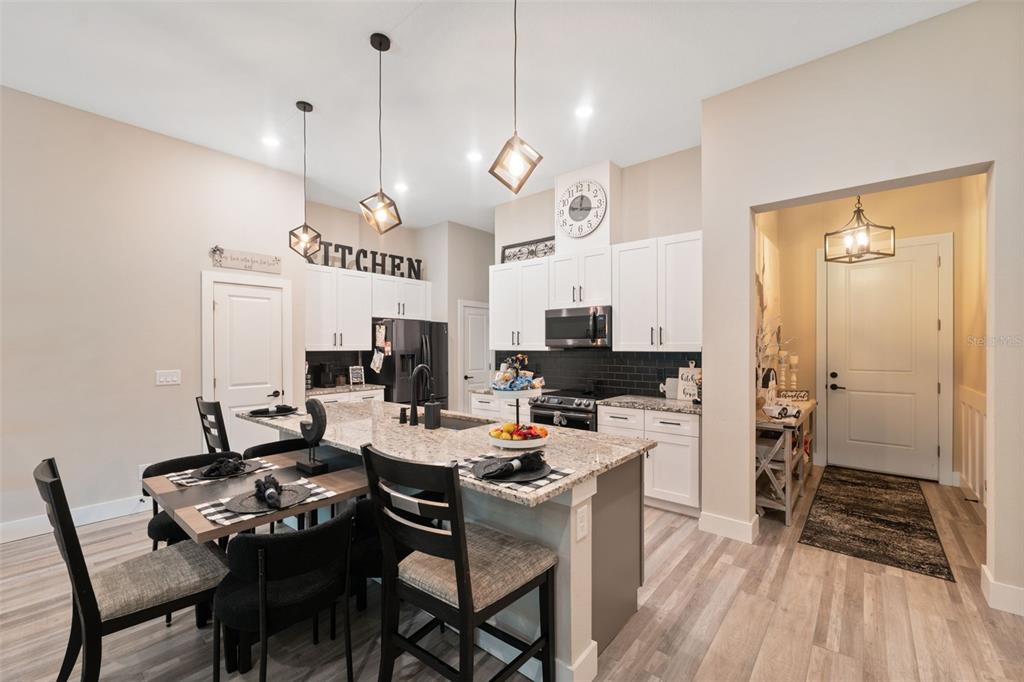 13073 Jaywalk Road Weeki Wachee, FL 34614 - Photo 6 of 44 a kitchen with a table and chairs in it
