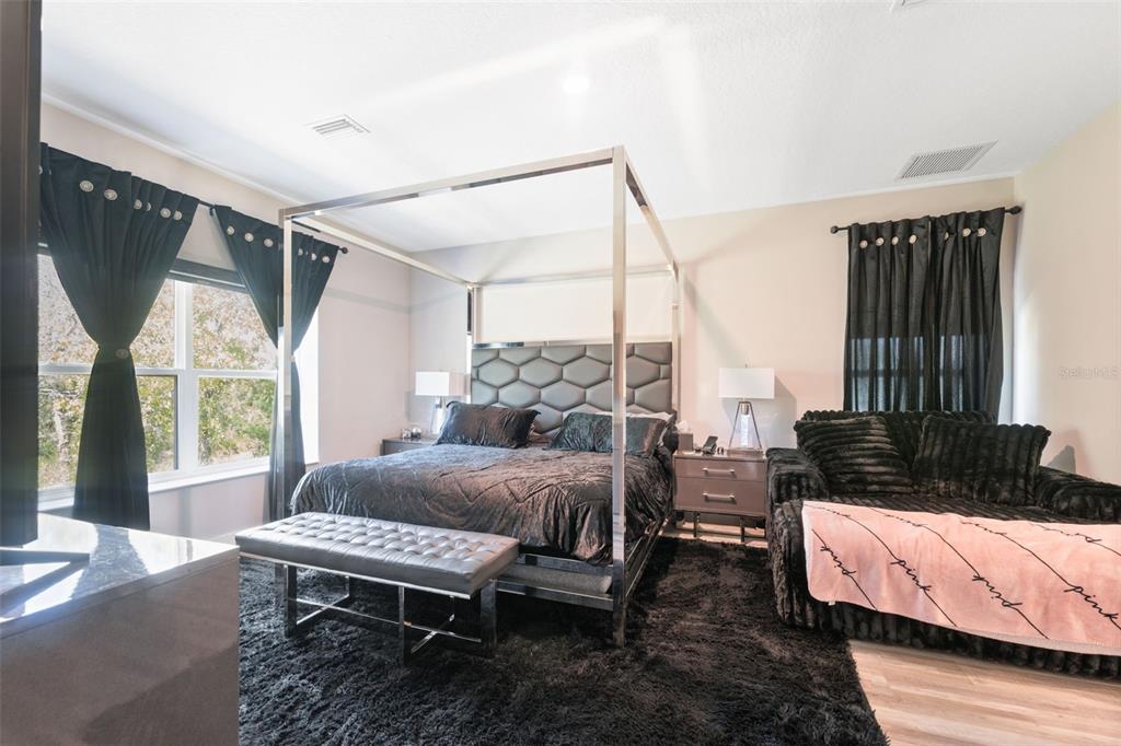 13073 Jaywalk Road Weeki Wachee, FL 34614 - Photo 9 of 44 a bedroom with a bed window and a table