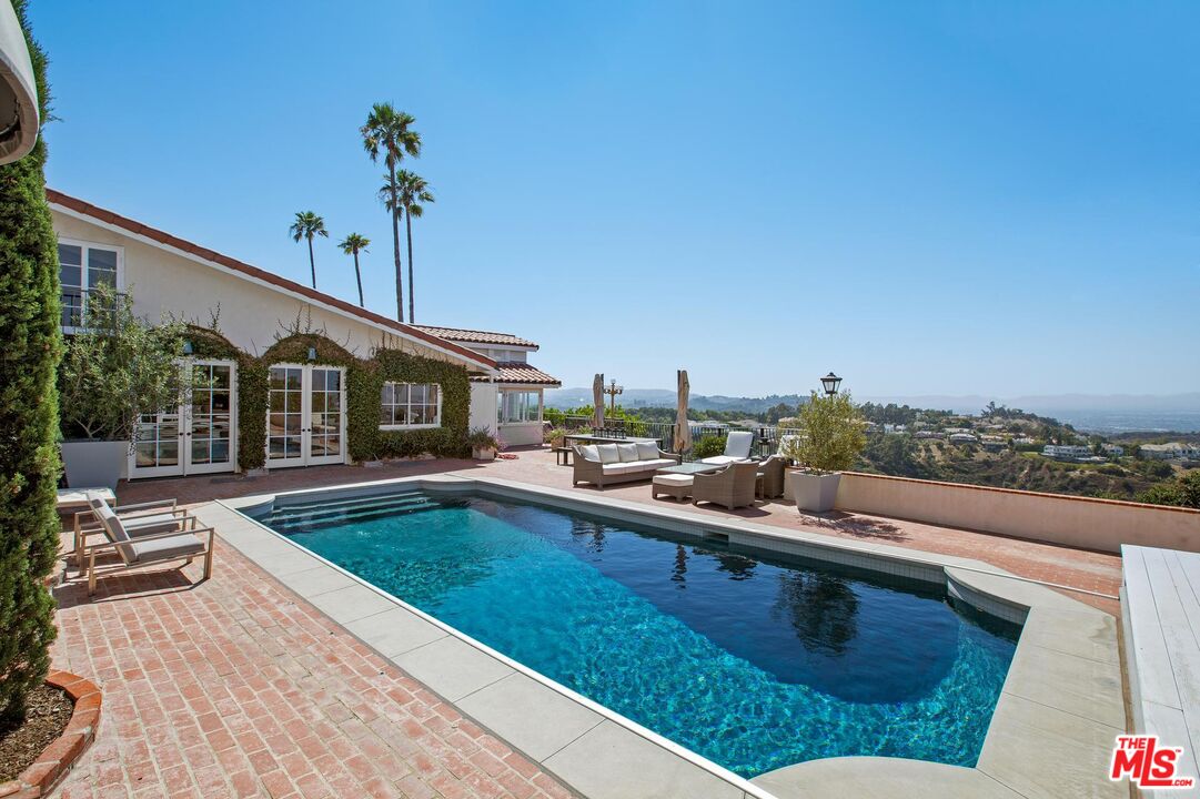 a view of a patio with swimming pool