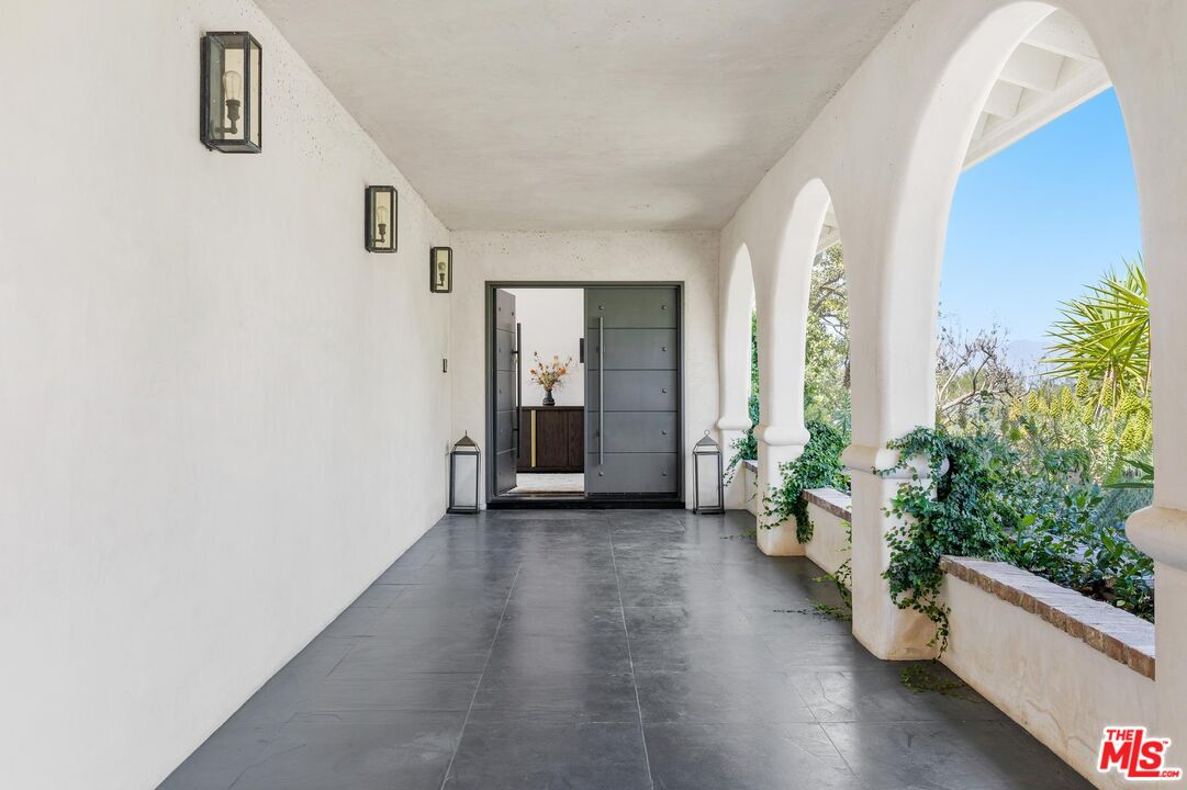 8663 Edwin Drive Los Angeles, CA 90046 - Photo 11 of 11 an empty room with potted plants and wooden floor