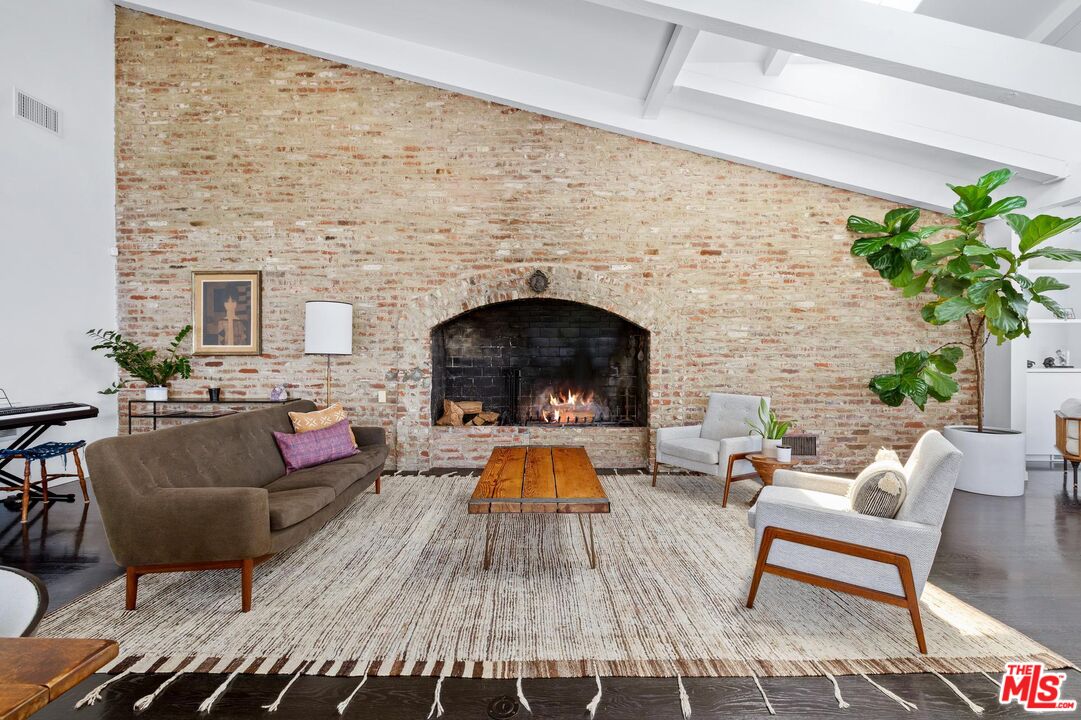 8663 Edwin Drive Los Angeles, CA 90046 - Photo 4 of 11 a living room with furniture and a fireplace